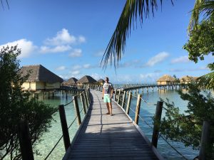 Boardwalk to the overwater bungalows at le Taha'a island resort and spa.